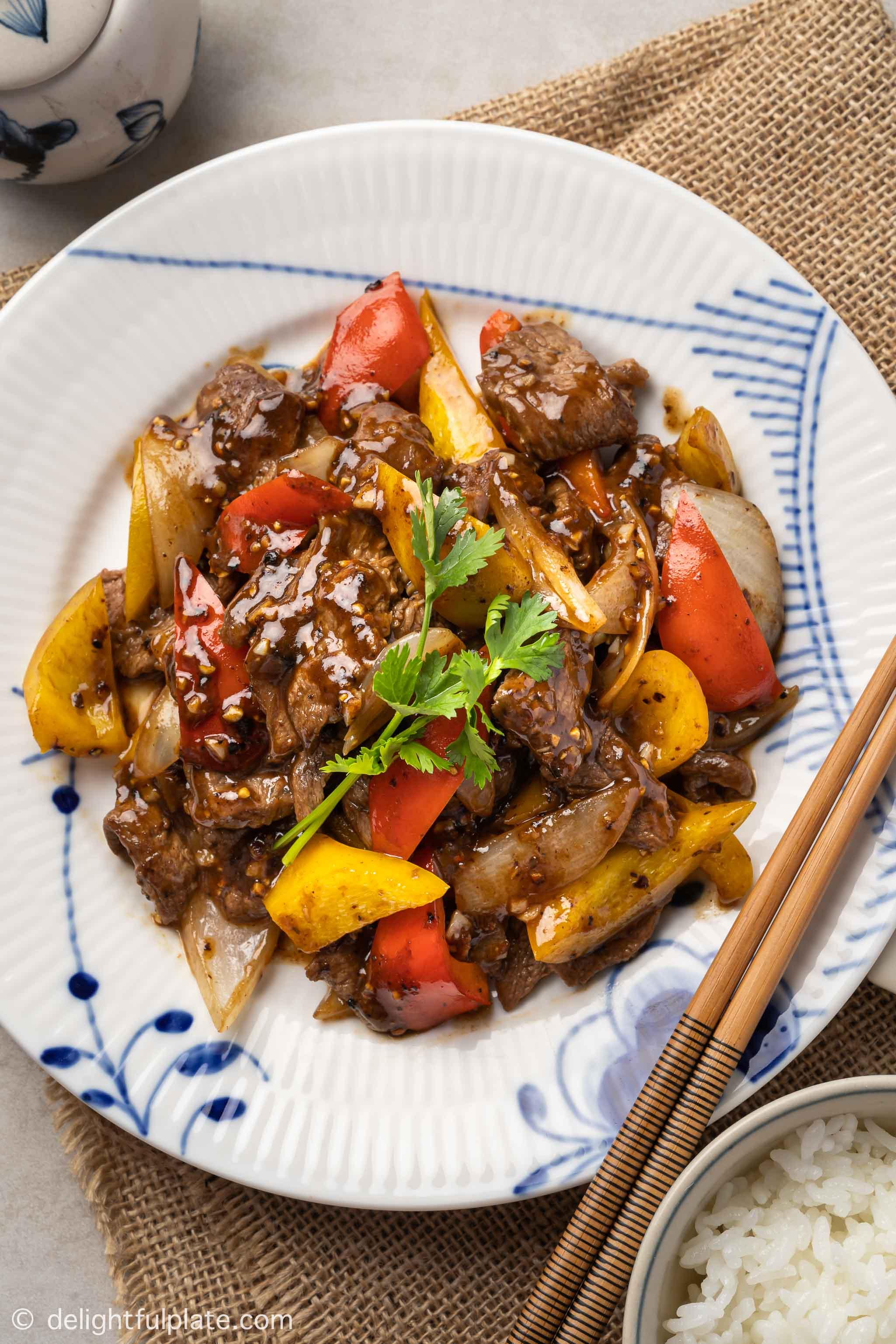 a plate of black pepper beef stir-fry